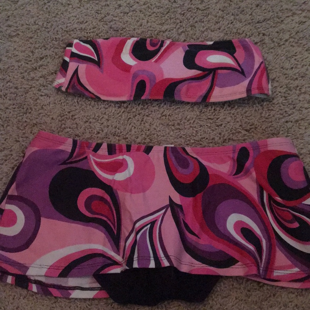 Two piece pink , purple and black swimsuit.